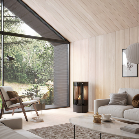 Stufa a bioetanolo CARO 90 BIO in nero in un luminoso soggiorno con molto legno