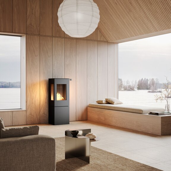 Stufa a bioetanolo NEXO 120 BIO in colore nero in un soggiorno dall'aspetto naturale