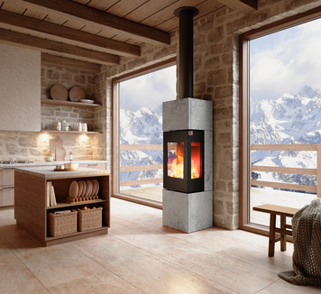 Stufa a legna NEXO 160 Pietra ollare in colore nero nel soggiorno con vista sulle montagne
