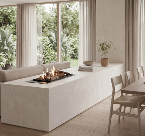 Camino a Bioetanolo Logicwood Linear, installato in una parete in pietra beige come divisorio per ambienti tra il soggiorno e la sala da pranzo